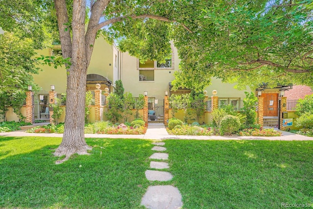 490 Columbine St Unit 5, Denver, CO 80206 - view of front facade featuring a gate and stucco siding