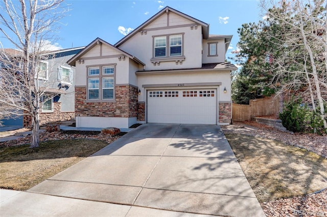 4542 Valleybrook Dr, Highlands Ranch, CO 80130 - craftsman-style house featuring stone siding, stucco siding, fence, concrete driveway, and an attached garage