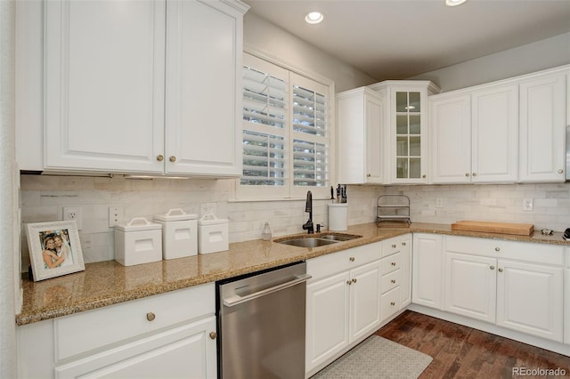 4542 Valleybrook Dr, Highlands Ranch, CO 80130 - kitchen featuring dishwasher, a sink, glass insert cabinets, white cabinets, and dark wood finished floors