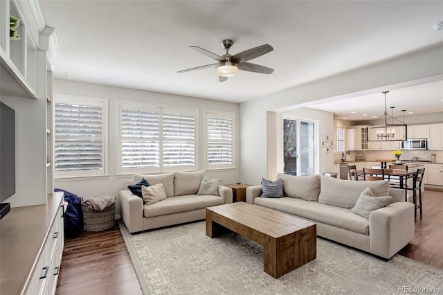 4542 Valleybrook Dr, Highlands Ranch, CO 80130 - living area with ceiling fan, light wood-style floors, a chandelier, and recessed lighting
