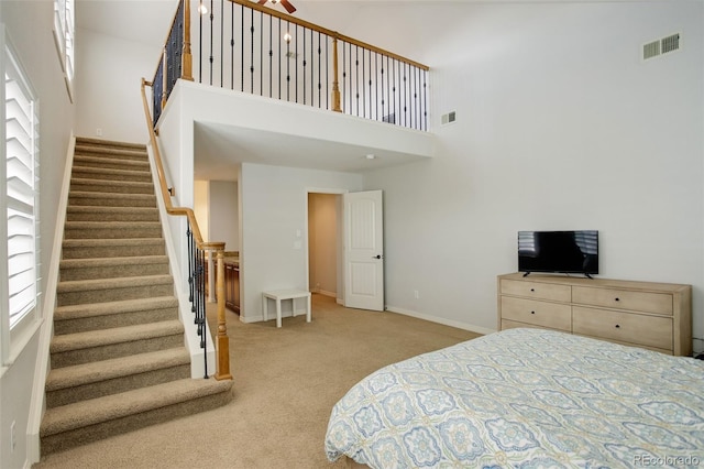 4542 Valleybrook Dr, Highlands Ranch, CO 80130 - bedroom featuring carpet floors, a towering ceiling, and baseboards