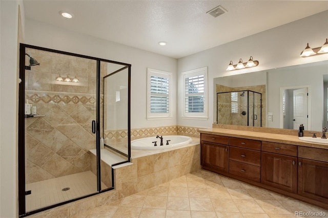 4542 Valleybrook Dr, Highlands Ranch, CO 80130 - full bath featuring a garden tub, a stall shower, vanity, and tile patterned flooring