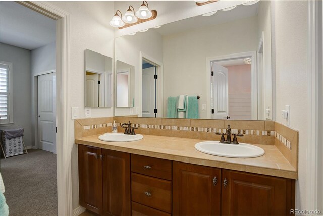 4542 Valleybrook Dr, Highlands Ranch, CO 80130 - bathroom with backsplash and double vanity
