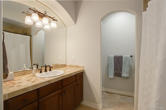 4542 Valleybrook Dr, Highlands Ranch, CO 80130 - full bath featuring vanity, baseboards, and tile patterned flooring