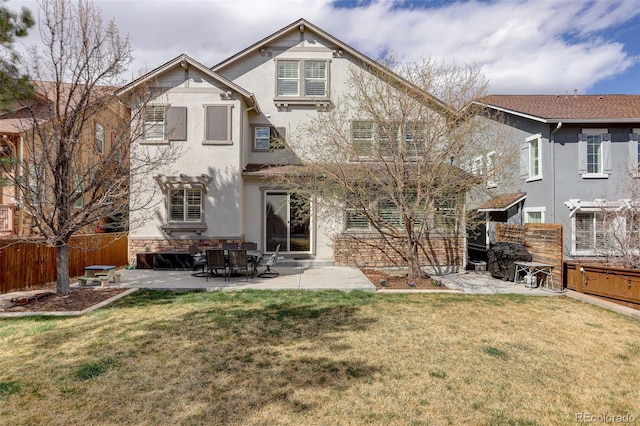 4542 Valleybrook Dr, Highlands Ranch, CO 80130 - rear view of house with stucco siding and a patio area