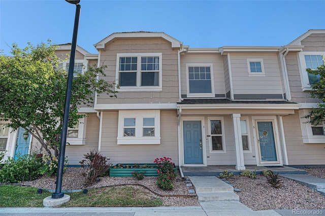 18954 E 57th Pl Unit D, Denver, CO 80249 - townhome / multi-family property featuring covered porch