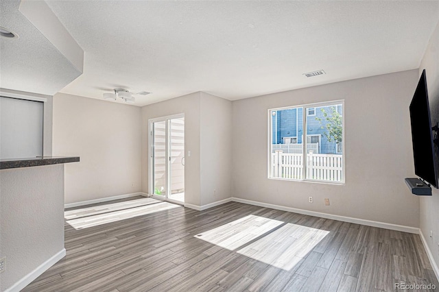 18954 E 57th Pl Unit D, Denver, CO 80249 - unfurnished room featuring wood finished floors and baseboards