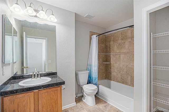 18954 E 57th Pl Unit D, Denver, CO 80249 - bathroom featuring vanity, shower / tub combo with curtain, tile patterned floors, a textured ceiling, and a textured wall
