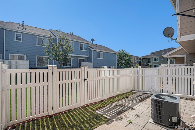 18954 E 57th Pl Unit D, Denver, CO 80249 - fenced backyard featuring a patio and a residential view