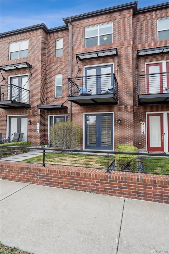 view of property with brick siding