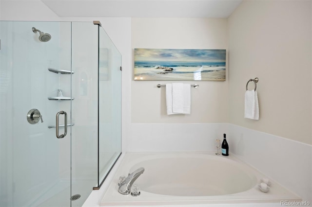 full bath with a stall shower and a bath