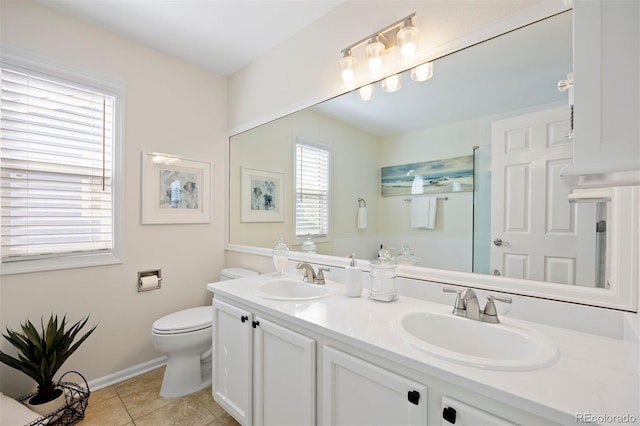full bathroom with toilet, baseboards, tile patterned flooring, double vanity, and a shower