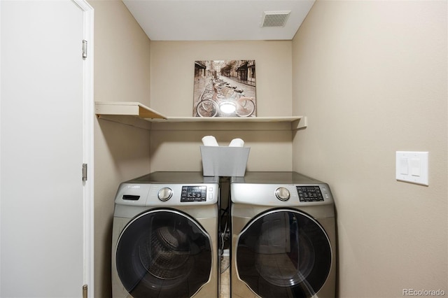 laundry room with washer and clothes dryer