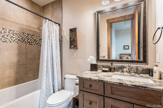 full bathroom featuring vanity, shower / bath combo, and toilet