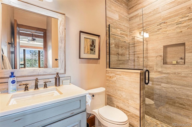 bathroom with vanity, toilet, and walk in shower