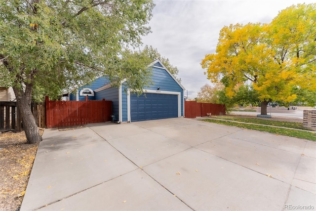 view of property exterior with a garage