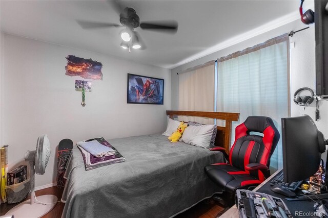 bedroom featuring hardwood / wood-style flooring and ceiling fan