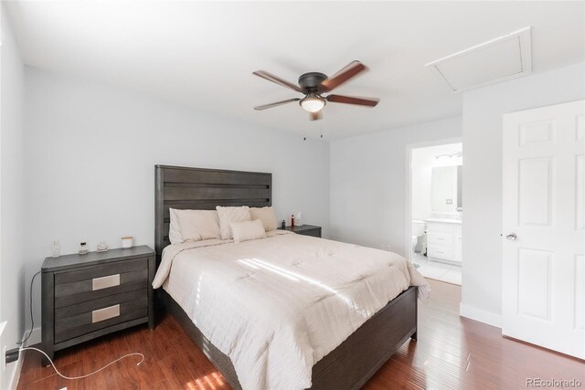 bedroom with ceiling fan, dark hardwood / wood-style floors, and ensuite bath