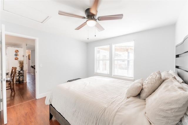 bedroom with wood-type flooring and ceiling fan