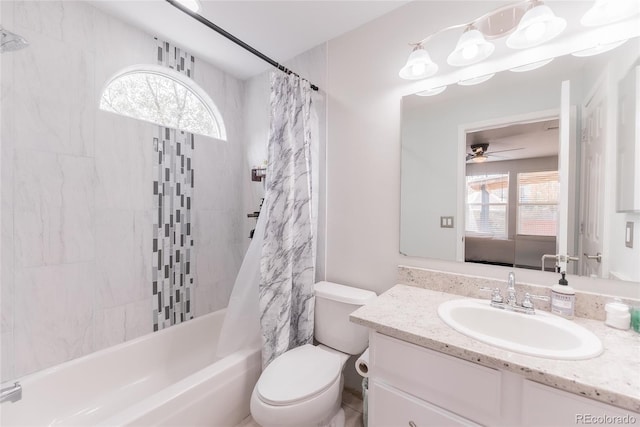 full bathroom featuring shower / bath combo, ceiling fan, vanity, and toilet