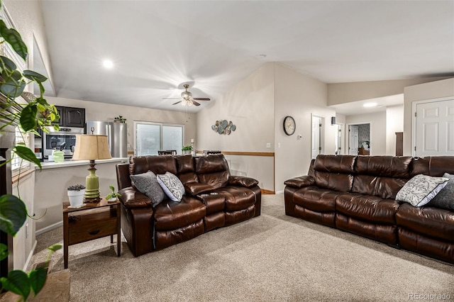 carpeted living room featuring lofted ceiling and ceiling fan