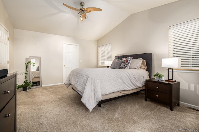 carpeted bedroom with lofted ceiling and ceiling fan