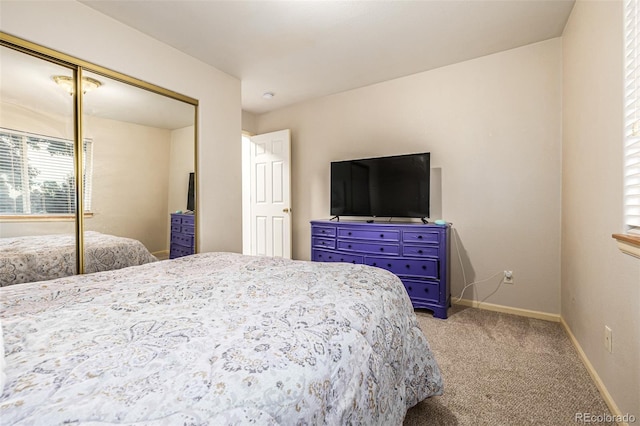 bedroom featuring light carpet and a closet