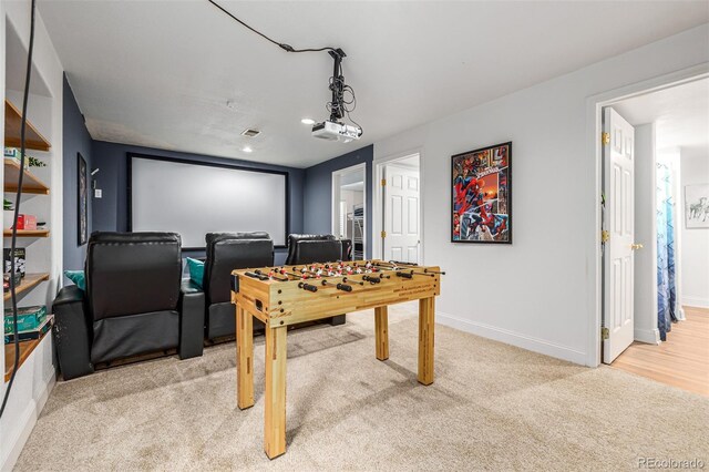 recreation room with light carpet