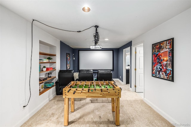 recreation room with light colored carpet