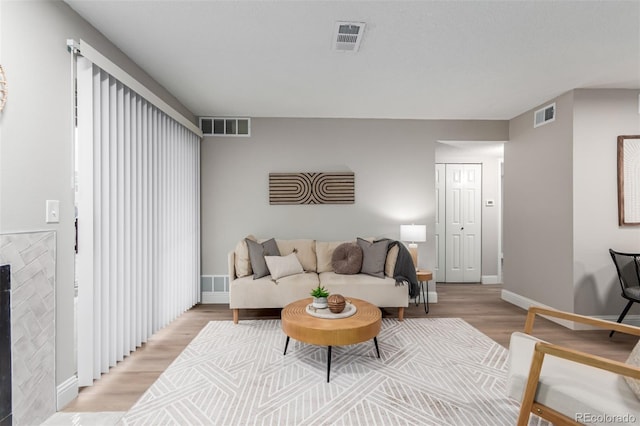 living room featuring light wood-style floors and baseboards