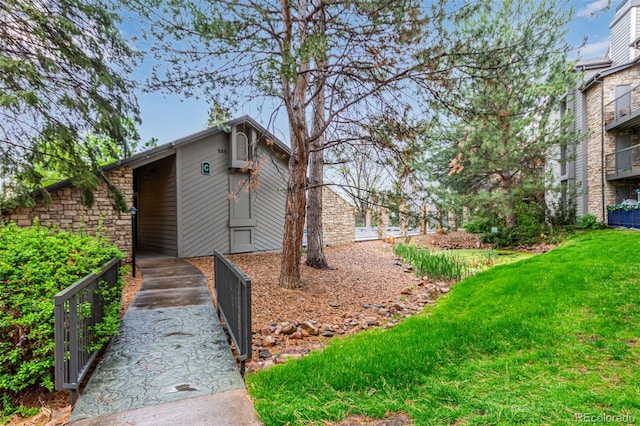 view of side of property featuring a lawn