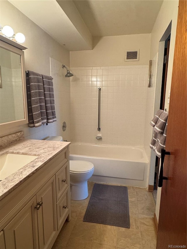 full bathroom featuring tile patterned flooring, vanity, toilet, shower / washtub combination, and visible vents