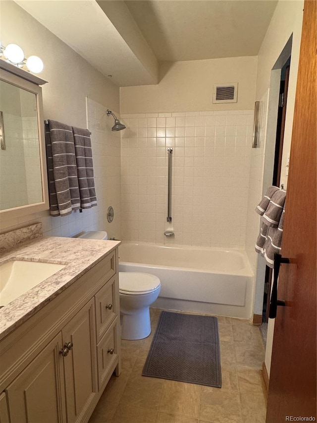 bathroom with visible vents, tile patterned flooring, vanity, tub / shower combination, and toilet