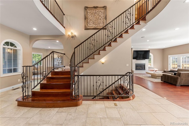 stairs featuring hardwood / wood-style floors