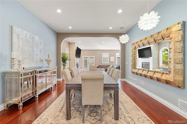 dining area with dark hardwood / wood-style flooring