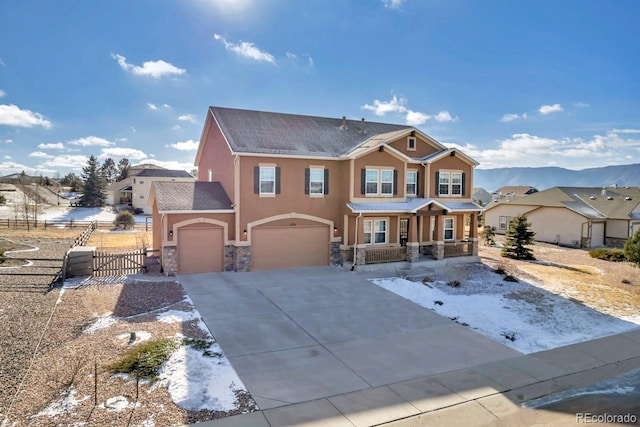 view of front of house featuring a mountain view and a garage