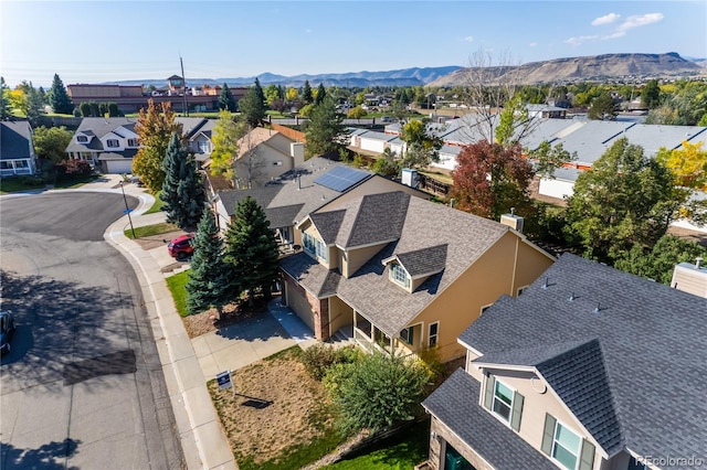 birds eye view of property featuring a mountain view