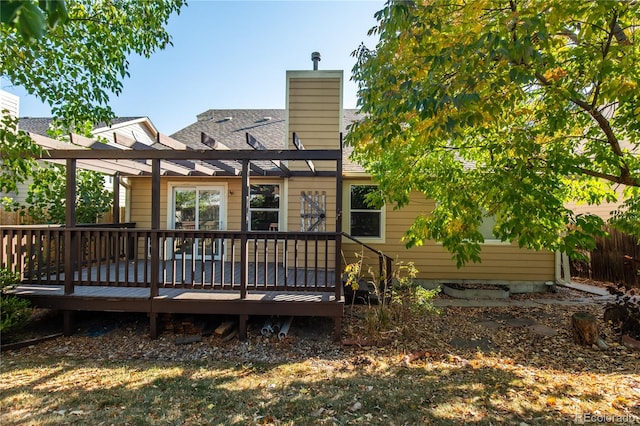 rear view of property with a wooden deck