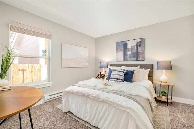 bedroom with light carpet and a baseboard heating unit