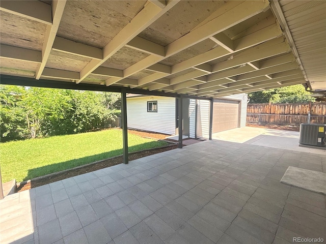 8239 Nola Dr, Denver, CO 80221 - view of patio with a garage and a carport