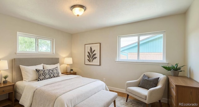 8239 Nola Dr, Denver, CO 80221 - bedroom with dark wood finished floors and baseboards