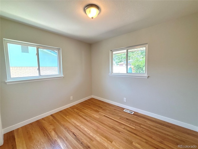 8239 Nola Dr, Denver, CO 80221 - empty room with baseboards and light wood finished floors