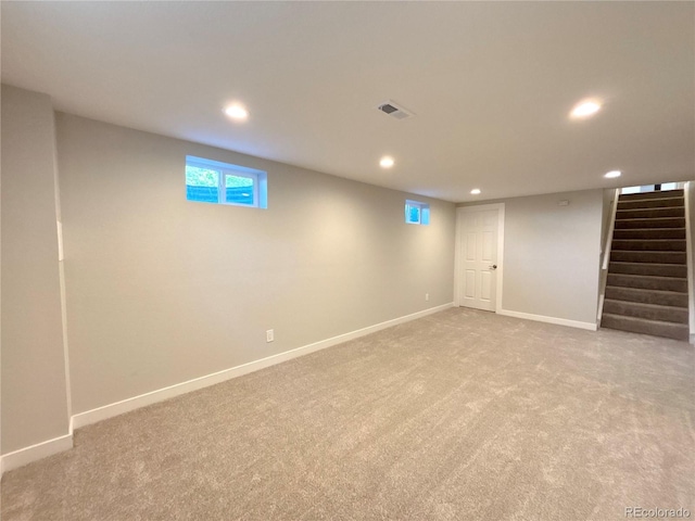 8239 Nola Dr, Denver, CO 80221 - basement with recessed lighting, light carpet, and stairway