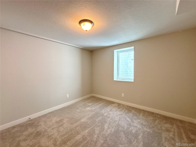 8239 Nola Dr, Denver, CO 80221 - spare room featuring light colored carpet and a textured ceiling