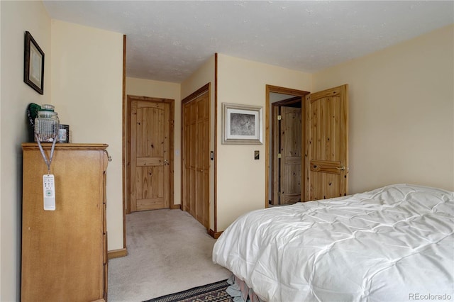 bedroom featuring light carpet