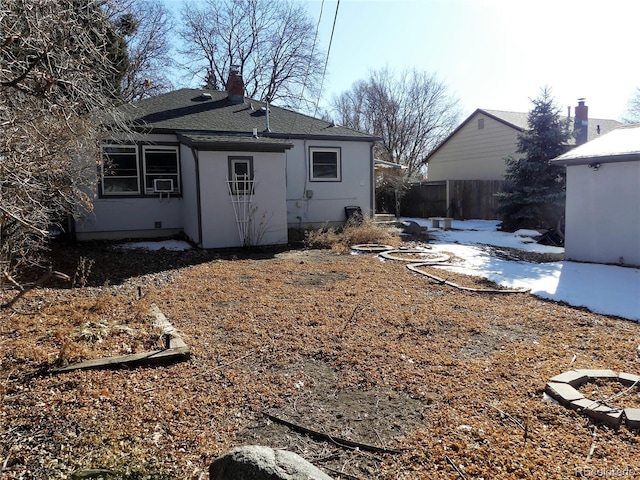 back of house featuring cooling unit