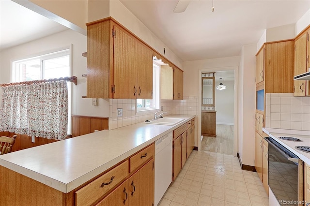 kitchen featuring backsplash, ceiling fan, white appliances, and sink