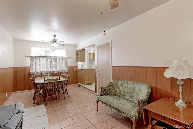 dining space featuring ceiling fan and light tile patterned floors