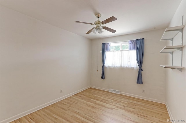 unfurnished room with ceiling fan and light wood-type flooring