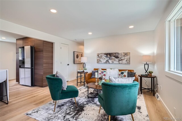 2065 Depew St, Edgewater, CO 80214 - living area featuring light wood-style floors, recessed lighting, and baseboards